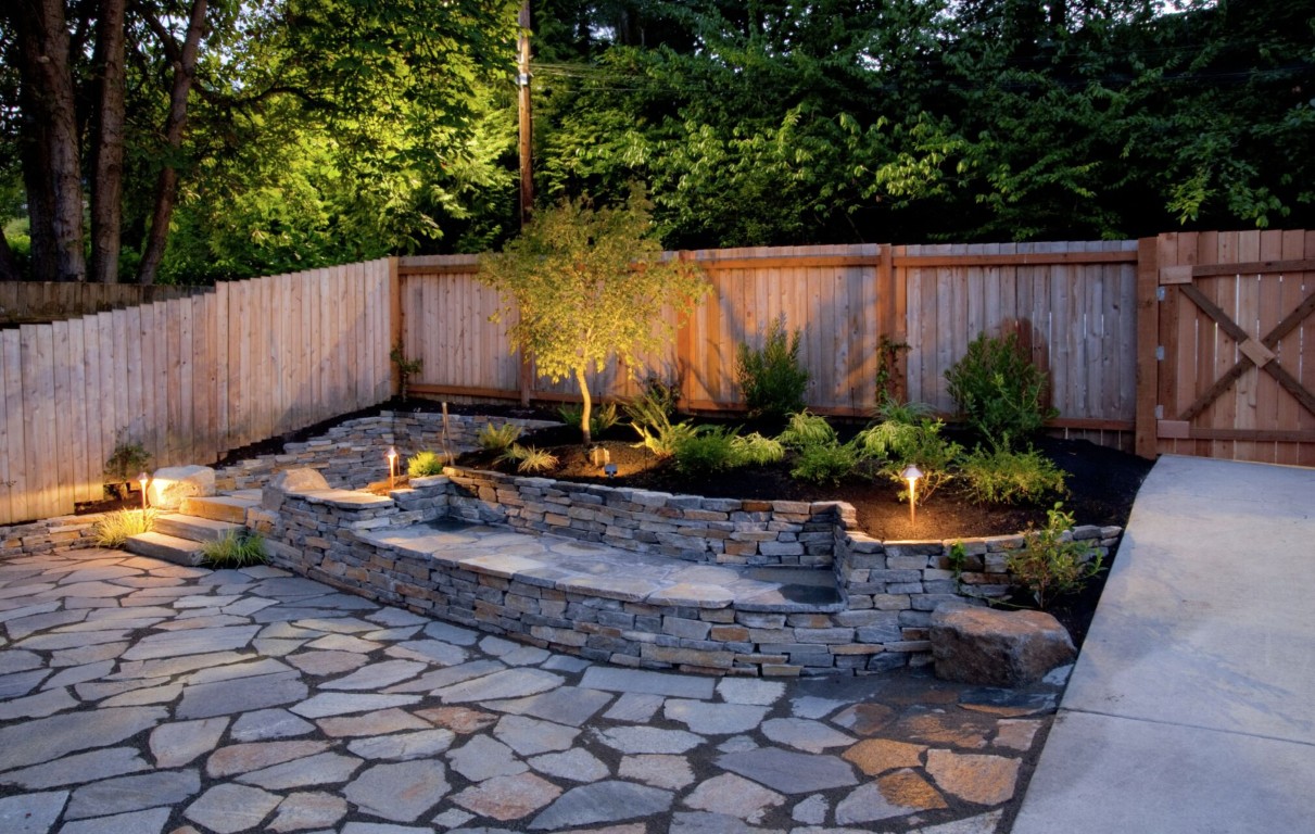 Professional landscaping services in Santa Ana, CA featuring custom hardscape design with paver patios and landscape lighting